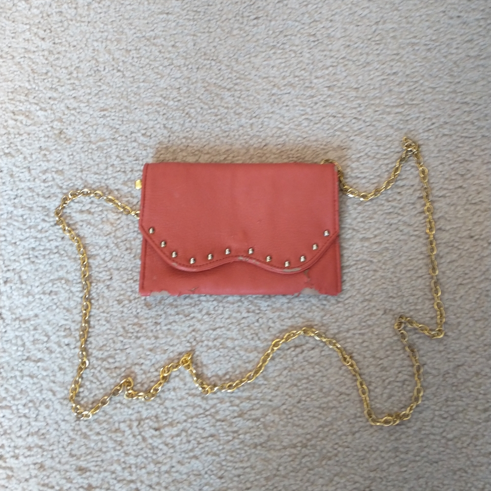 Gold and a Rich Red-Pink Purse with Gold Chain